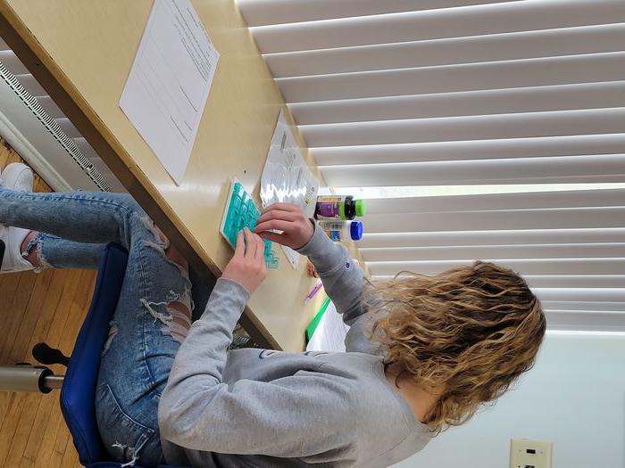 A student in OT 103 completes an activity analysis of medication management.